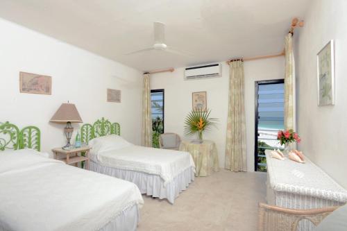 a hotel room with two beds and a window at Provender home in Savannah Sound