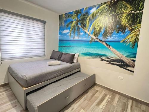 a bedroom with a bed with a palm tree mural at Charming San Carlos BB with Private Pool BBQ in San Carlos