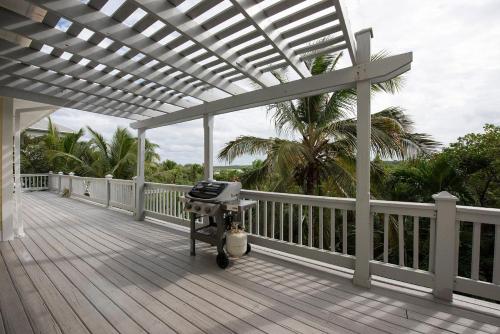 a grill on the deck of a house at Salty Dolphin home in Governorʼs Harbour