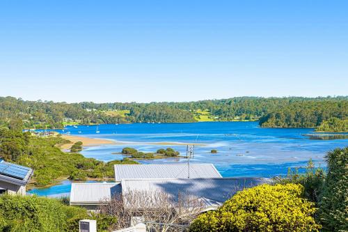 arial view of a river with trees and buildings at Nestle In Narooma - 10 Hillcrest Ave North Narooma in Kianga