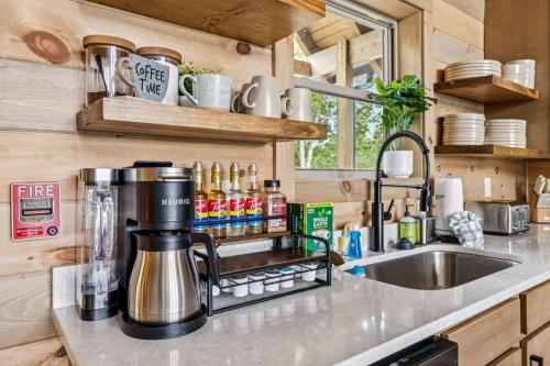 a kitchen with a coffeemaker on a counter at Golden Oaks Cabin home in Walland