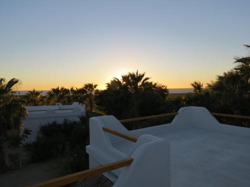 a view of the sunset from the balcony of a house at Villa Gardenia - Oceanview Villas w Pool in Todos Santos