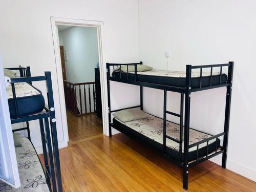 two bunk beds in a room with a mirror at EXPO Hostel in Sao Paulo