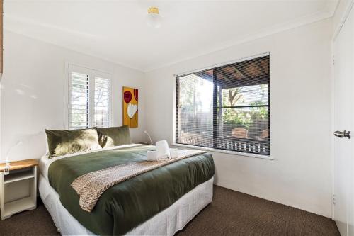 a bedroom with a bed and a window at Little Freycinet - NEW in Gnarabup
