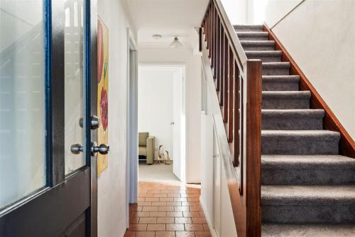 a staircase in a house with a door open at Little Freycinet - NEW in Gnarabup