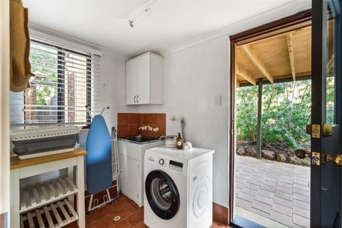 a kitchen with a washer and dryer in a room at Little Freycinet - NEW in Gnarabup