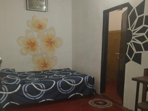 a bedroom with a bed and a mirror at 20 House Arugam in Arugam Bay