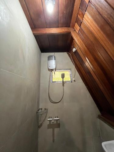 a bathroom with a shower and a sink in a room at Soluta Resort in Wainapal
