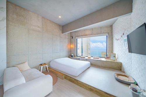 TV a/nebo společenská místnost v ubytování Gangneung Memory Stay Ocean View Pension