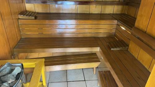 an empty sauna with a bench and a table at Whole Ocean View Manila Bay 4 Bedrooms in Manila