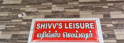 a red sign sitting on top of a floor at Shivv's Leisure in Ooty