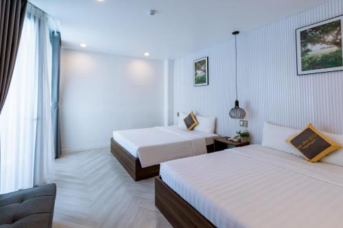Cama o camas de una habitación en Tuấn Ninh Hotel II