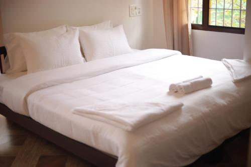 Ένα ή περισσότερα κρεβάτια σε δωμάτιο στο Fort Verdant Homestay