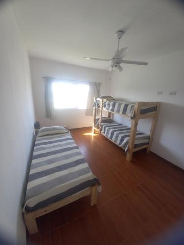 Ένα ή περισσότερα κρεβάτια σε δωμάτιο στο Casa Funes Town