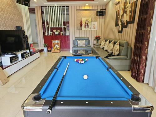 a living room with a pool table in the middle at Tiên Hoa Sơn Villa in Da Lat