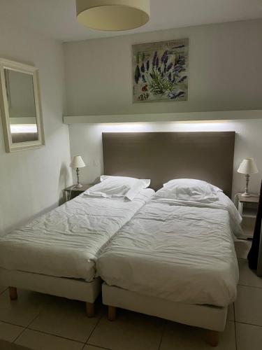 Llit o llits en una habitació de Agapanthe