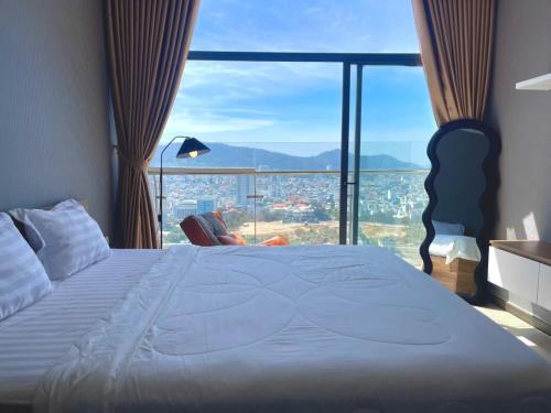 Postel nebo postele na pokoji v ubytování CSJ Tower Vung Tau