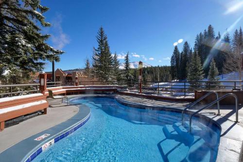 a large swimming pool in a resort with trees at 2 Bedroom Beaver Run Condo, Ski-in Ski-out, Dog Friendly, On Peak 9 in Breckenridge