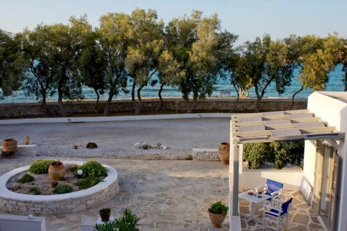 a view of the beach from the balcony of a house at Almira Suites - Seafront - Naousa Paros in Naousa