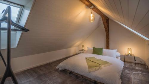 a bedroom with a bed in a attic at Löwenplatz Apartment near Station by Airhome in Zürich