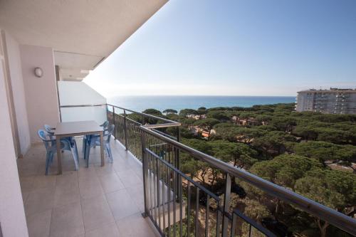 a balcony with a table and chairs and the ocean at Apartamentos Blanes-Condal Costa Brava in Blanes