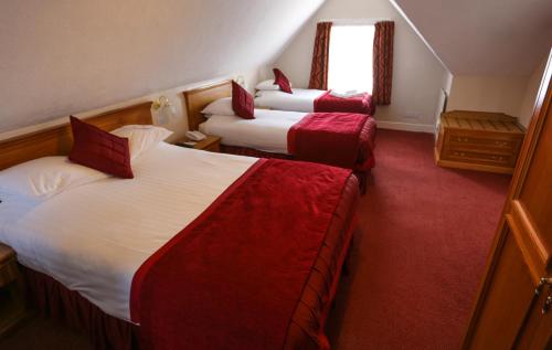 Postel nebo postele na pokoji v ubytování Royal Exeter Hotel