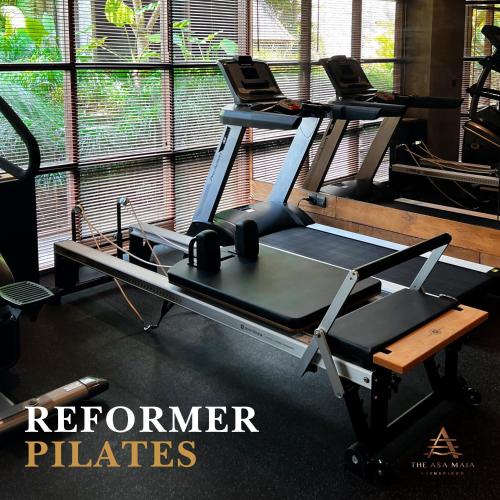 a gym with a reformer pilates machine at The Asa Maia - Bespoke Wellness Resort in Uluwatu