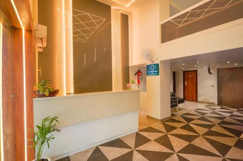 a lobby of a building with a reception desk at Hotel Comfort Court in Amritsar