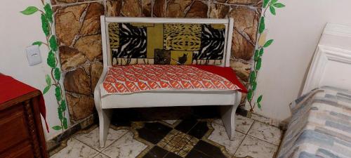 a chair sitting in a corner of a room at OYO Hotel Tbs in Manacapuru