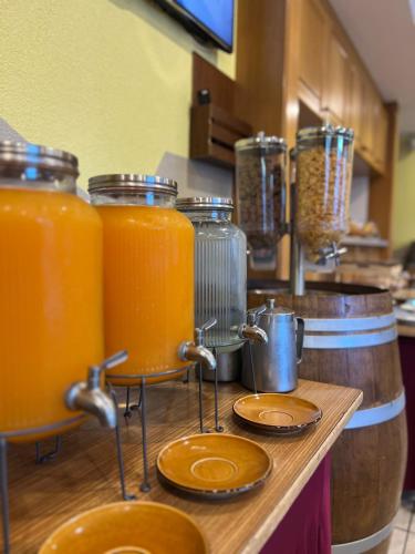 a bunch of jars of orange juice on a counter at Touristenheim Bergfreude in Leukerbad