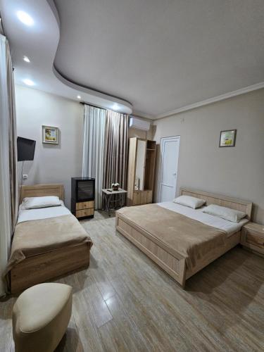 Ein Bett oder Betten in einem Zimmer der Unterkunft Guesthouse Maka