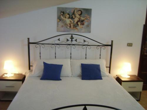 Säng eller sängar i ett rum på La Dimora dell'Ippocampo