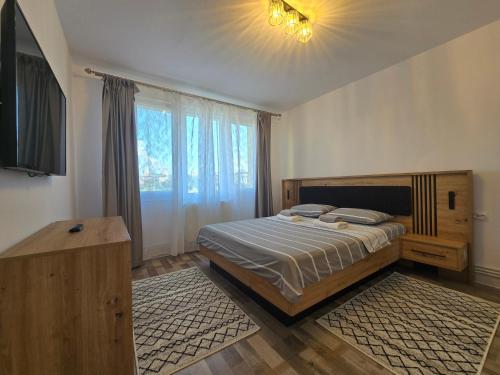 Ένα ή περισσότερα κρεβάτια σε δωμάτιο στο Best Apartament Central 2