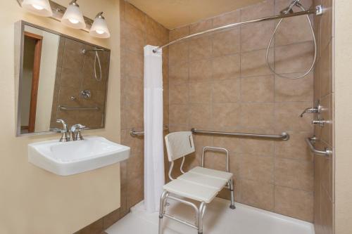 a bathroom with a sink and a shower at Baymont by Wyndham Midland in Midland