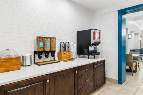 a counter in a restaurant with a coffee shop at Hampton Inn Laramie in Laramie
