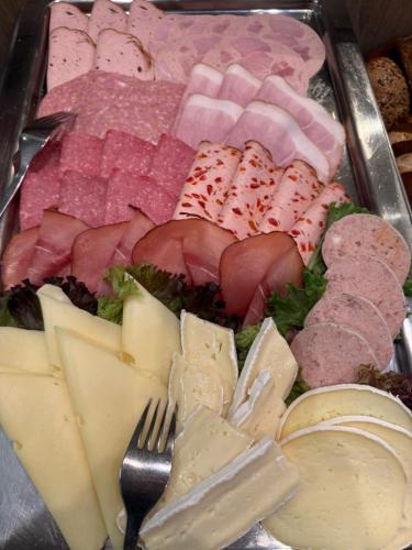 a tray of different types of meats and cheese at Metzgerei Herbst in Besigheim