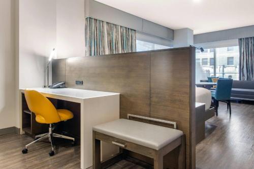 an office with a desk and a yellow chair at Cambria Hotel Downtown-Center City in Philadelphia