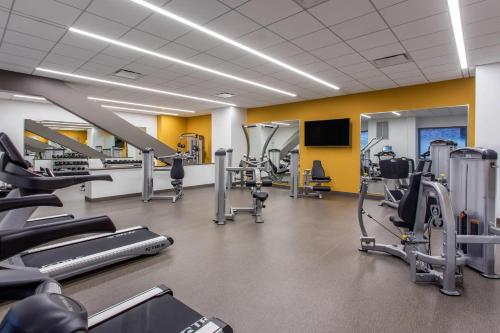 a gym with several treadmills and cardio machines at Cambria Hotel Downtown-Center City in Philadelphia