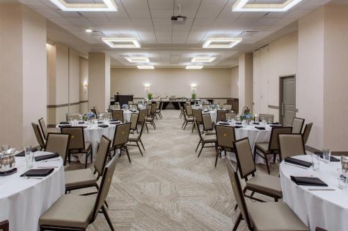 a conference room with tables and chairs in it at Cambria Hotel Downtown-Center City in Philadelphia