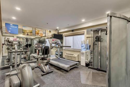 a gym with treadmills and machines in a room at Comfort Inn Murray – Salt Lake City South in Murray