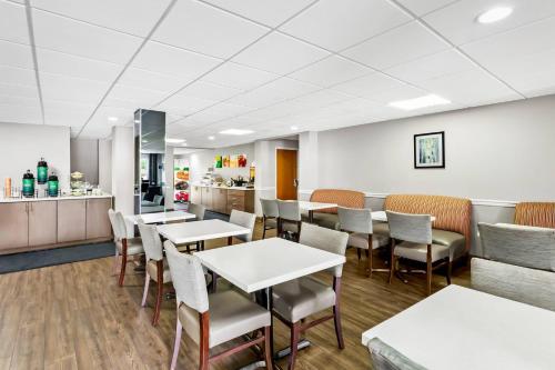 a restaurant with tables and chairs and a counter at Quality Inn & Suites I-81 Exit 7 in Bristol