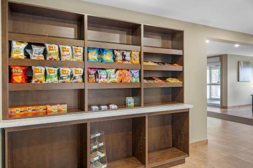 a walk in pantry with lots of bags of chips at Quality Inn & Suites in Bathurst