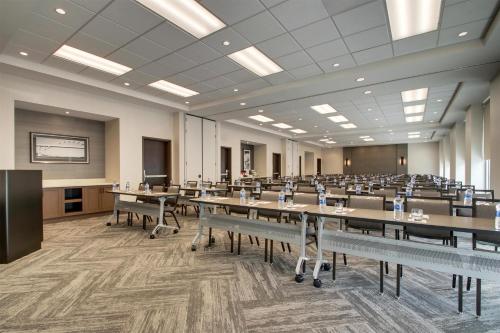 a large room with tables and chairs in it at Hyatt Place Milwaukee Downtown in Milwaukee