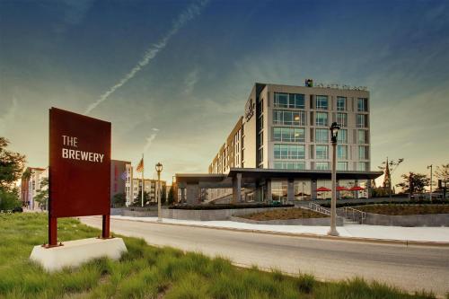 a building with a sign on the side of a road at Hyatt Place Milwaukee Downtown in Milwaukee