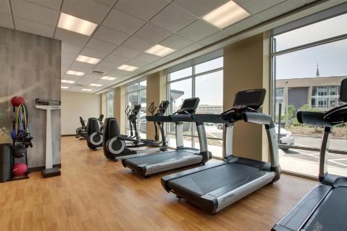 a gym with treadmills and elliptical machines at Hyatt Place Milwaukee Downtown in Milwaukee
