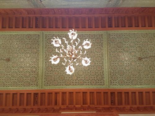 a chandelier hanging from the ceiling of a room at Riad Dar Karima in Rabat