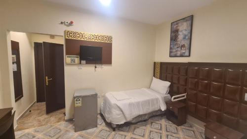 Postel nebo postele na pokoji v ubytování فندق دار الشروق