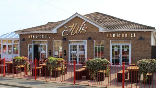 a building with a sign on the front of it at M15 Meadow View Golden palm in Chapel Saint Leonards