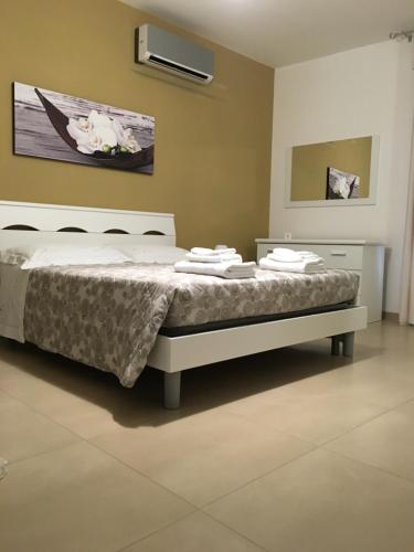 Ένα ή περισσότερα κρεβάτια σε δωμάτιο στο B&B Il Quadrifoglio