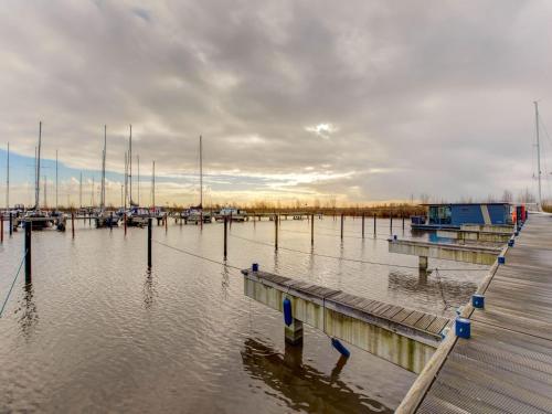 a marina with many boats in the water at Houseboat in Volendam near Fort Edam in Volendam